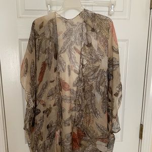 Kimono in tan with fall color accents.